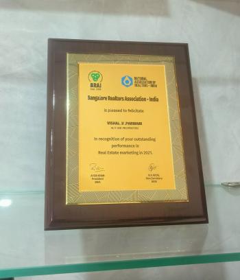 Recognition for Outstanding achievement in Real estate markieting for yr 2021- to Vishal V Parwani SSB Properties - presented by Bangalore Realtors Association-India - 2021